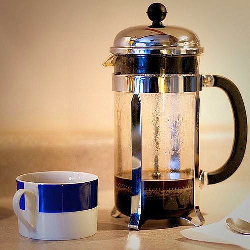 french press coffee with cup