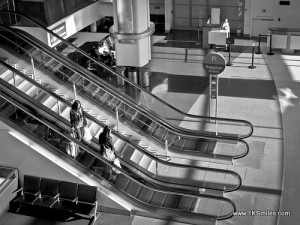 escalator black and white two girls troy swezey