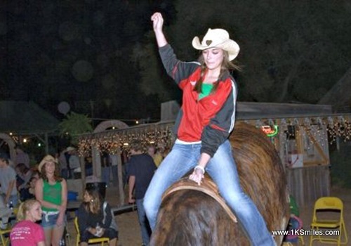 mechanical bull girl red jacket 1ksmiles