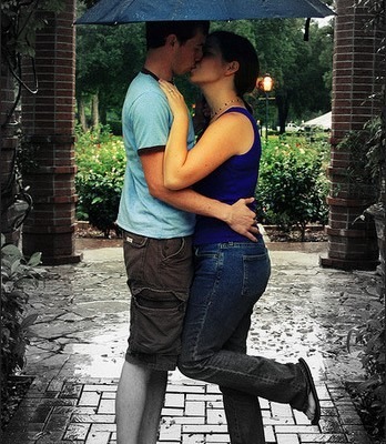 welcome home couple kissing on porch