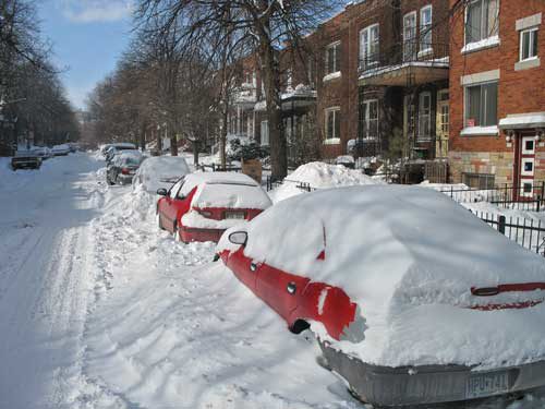 silver white winters melting ice man montreal snow street cars